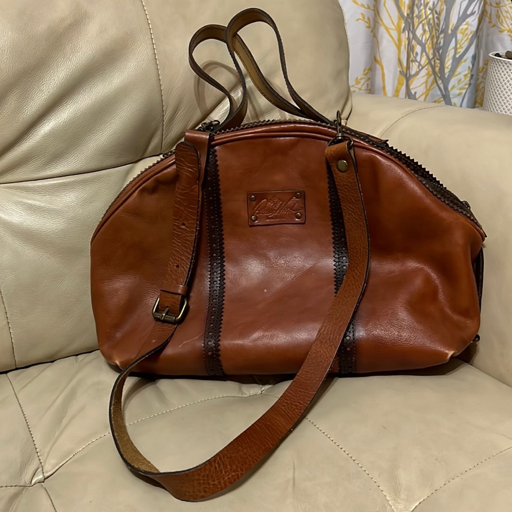 Italian Leather Patricia Nash adjustable crossbody purse with large handles.